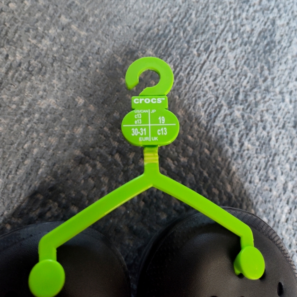 CROCS Black Clogs with Green Hanger